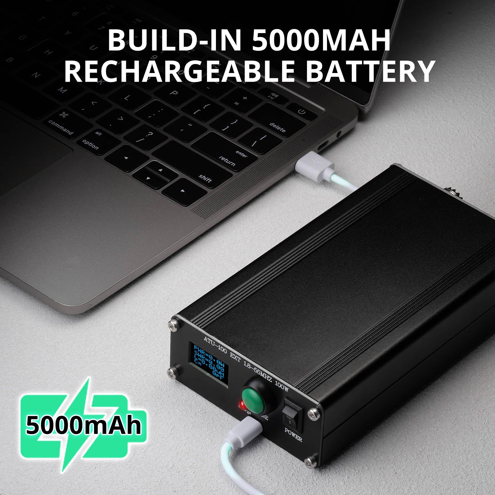 Laptop with a Radioddity ATU-100 Automatic Antenna Tuner labeled 'Build-in 5000mAh rechargeable battery' on a gray surface.