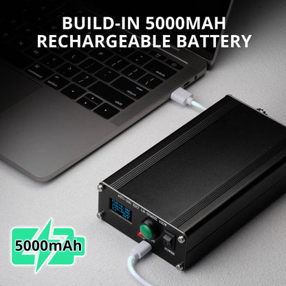 Laptop with a Radioddity ATU-100 Automatic Antenna Tuner labeled 'Build-in 5000mAh rechargeable battery' on a gray surface.
