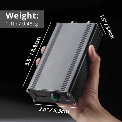 Hand holding a Radioddity ATU-100 Automatic Antenna Tuner with measurements displayed on a black background
