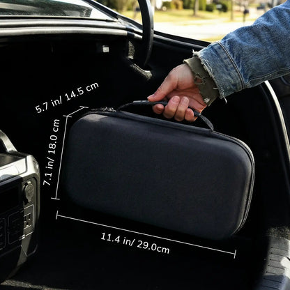 Black carrying case with dimensions being held by a person inside a car.