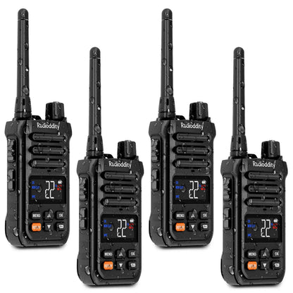 Four black X1 walkie-talkies with digital displays on a white background