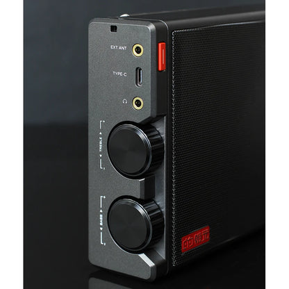 Side view of the black CHOYONG LC100 showing antenna and headphone sockets, USB-C port, and bass and treble knobs